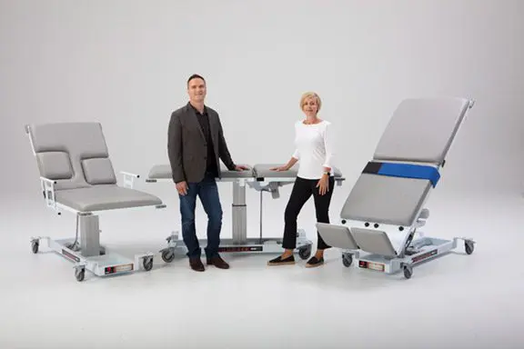 Medical tables with two people posing